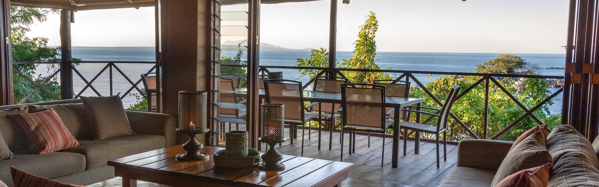 The stunning views of Lake Malawi from the veranda of a cottage at Blue Zebra Island Lodge are captured in this inviting travel photograph, showcasing a peaceful retreat over the lake’s shimmering waters. From the elevated vantage point, the expanse of blue stretches to the horizon, dotted with distant islands and framed by the lodge’s tropical gardens. Soft morning or evening light reflects on the calm surface, creating a serene atmosphere that emphasizes privacy, relaxation, and connection with nature. The scene highlights the lodge’s thoughtful design, blending comfort and style with the surrounding environment. Inspiration Africa curates bespoke, tailor-made journeys to Malawi and across Africa, combining lakeside escapes with immersive wildlife, cultural, and scenic experiences.