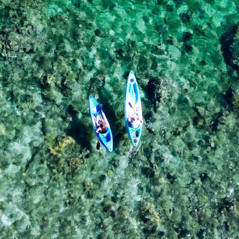 An aerial view of two kayaks gliding across the crystal-clear turquoise waters of Memba Bay in Mozambique captures a serene and idyllic moment along one of Africa’s most beautiful and unspoiled coastlines. The vivid shades of blue and green reveal the clarity of the Indian Ocean, while the gentle movement of the kayaks creates a sense of freedom, adventure, and connection with nature. Surrounded by pristine beaches and remote tropical scenery, Memba Bay offers an exceptional escape for travelers seeking both relaxation and exploration in an untouched marine paradise.
Inspiration Africa specializes in bespoke, tailor-made journeys across Mozambique and the African continent, creating immersive travel experiences that combine extraordinary coastal landscapes, authentic adventure, and unforgettable ocean experiences. From kayaking in turquoise lagoons to exclusive beach retreats and safari adventures, every itinerary is carefully curated to showcase the beauty, diversity, and spirit of Africa.
