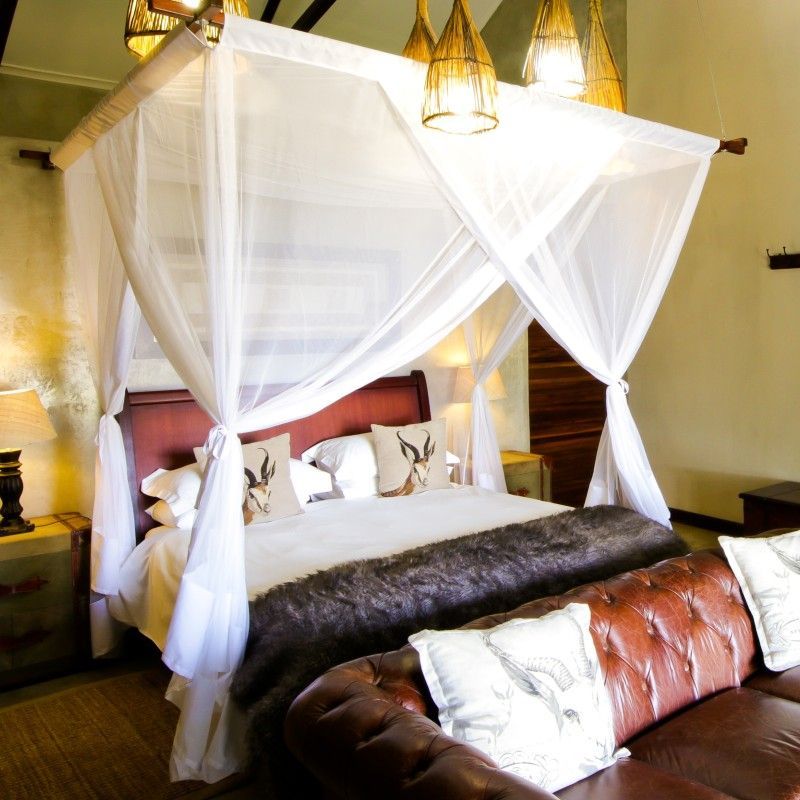 One of the elegantly designed bedrooms at Otijwa Eagle’s Nest in Namibia is captured in this inviting travel photograph, offering a luxurious retreat set amidst the dramatic savannah landscape. Natural materials, warm earthy tones, and carefully curated furnishings create a serene and stylish interior, while large windows and private terraces frame sweeping views of the surrounding wilderness. The bedroom reflects the lodge’s blend of comfort, sophistication, and connection to nature, providing an intimate space to relax after a day of wildlife viewing or exploration. Ideal for safari enthusiasts, photographers, and travelers seeking tranquility, this scene captures the elegance, serenity, and immersive charm that define Otijwa Eagle’s Nest. Inspiration Africa specializes in bespoke, tailor-made journeys to Namibia and across Africa, crafting unforgettable lodge stays and extraordinary safari experiences in exceptional landscapes.