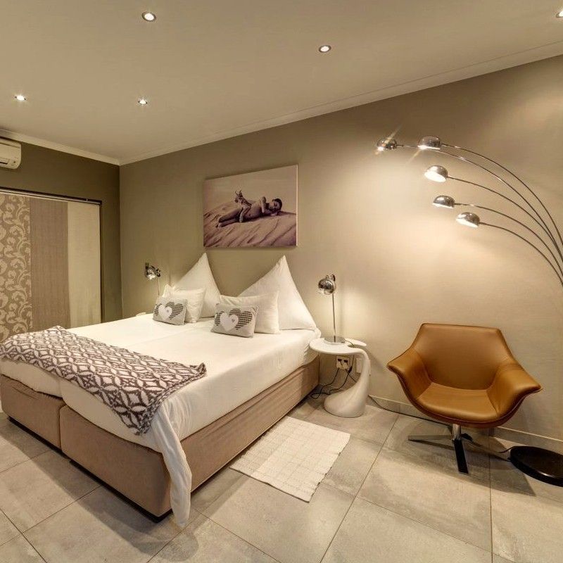 One of the luxury rooms at Utopia Boutique Hotel by the Naankuse Collection in Namibia is featured in this elegant travel photograph, showcasing a refined interior designed for comfort and relaxation. A beautifully styled bed, high-quality linens, and contemporary furnishings create a sophisticated yet welcoming atmosphere. Soft neutral tones, tasteful décor, and carefully curated details reflect the hotel’s boutique character while maintaining a calm and restful ambiance. Large windows allow natural light to fill the space, offering views of the surrounding landscape and enhancing the sense of openness. The image conveys a balance of modern luxury and understated elegance, providing guests with a tranquil retreat that complements Namibia’s scenic beauty. Inspiration Africa specializes in bespoke, tailor-made journeys to Namibia and across Africa, crafting unforgettable travel experiences in extraordinary destinations.