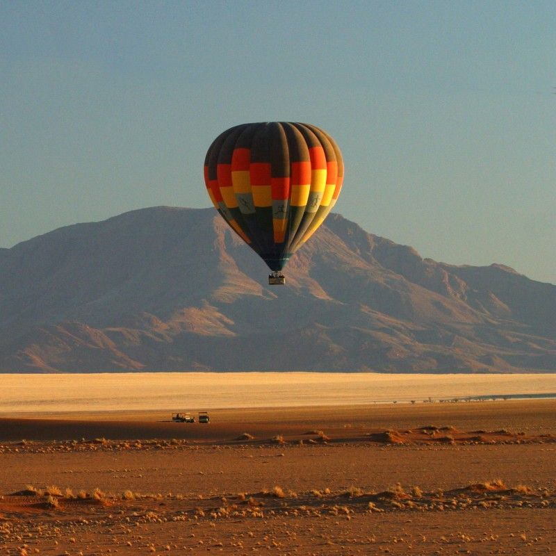 Hot air ballooning over the endless plains of the NamibRand Nature Reserve, just south of Sossusvlei, reveals Namibia’s desert from a breathtaking perspective. As the morning light touches dunes and mountains, the vast silence and scale of the landscape unfold beneath you. Inspiration Africa specializes in bespoke, tailor-made journeys to Namibia and across Africa, crafting extraordinary safari and adventure experiences in remarkable destinations.