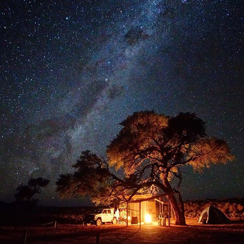 Discover the extraordinary night skies of Namibia while camping deep within the vast expanse of the NamibRand Nature Reserve. Far from artificial light, the desert transforms into a natural planetarium, where the Milky Way stretches brilliantly across the horizon. Inspiration Africa specializes in bespoke, tailor-made journeys to Namibia and across Africa, crafting extraordinary safari and adventure experiences in remarkable destinations.
