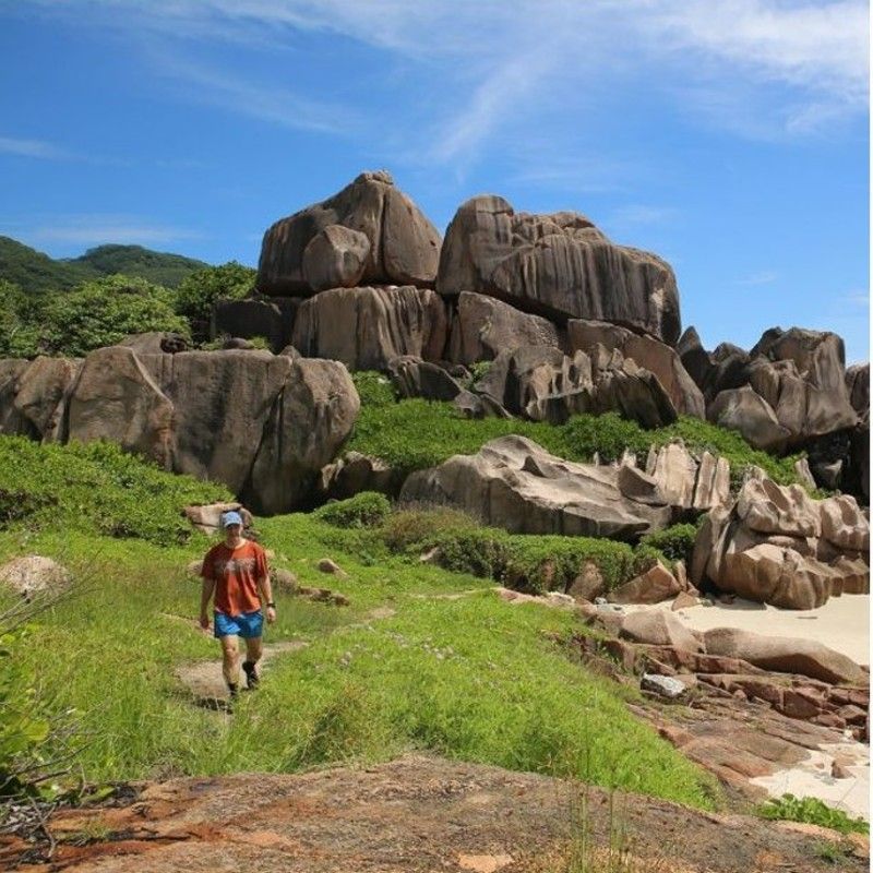 Hiking to Anse Major on Mahé in Seychelles offers a spectacular coastal trail winding through lush vegetation, dramatic granite formations, and sweeping ocean views. The reward is a secluded beach framed by turquoise waters and untouched nature. Inspiration Africa specializes in bespoke, tailor-made journeys to Seychelles and across Africa, crafting extraordinary safari and adventure experiences in remarkable destinations.