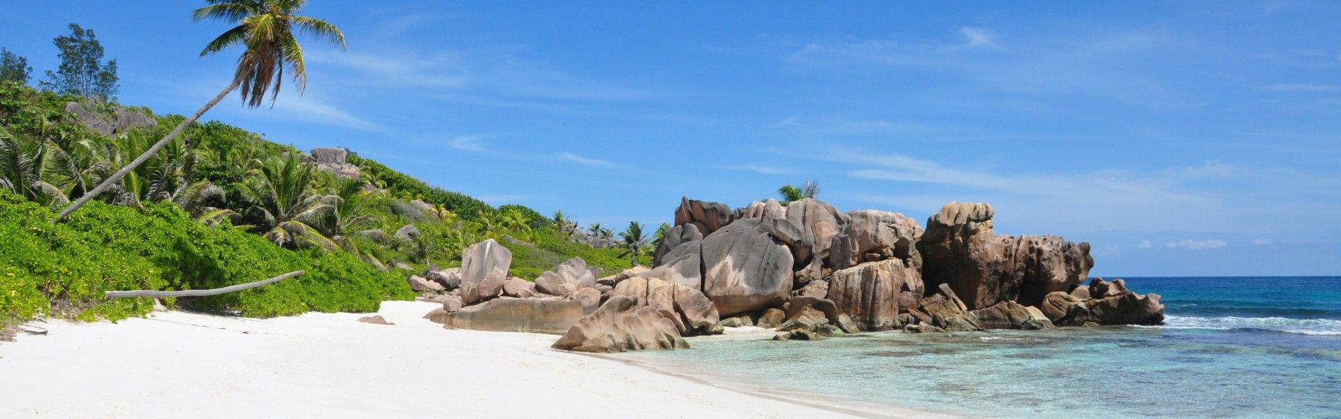 Coco Bay on La Digue Island in the Seychelles is a serene and secluded beach known for its stunning granite boulders and crystal-clear waters. Nestled on the island’s northeastern coast, this hidden gem is perfect for snorkeling, offering a vibrant underwater world of coral reefs and marine life. Its peaceful atmosphere and natural beauty make Coco Bay an ideal spot for those seeking tranquility and a connection with nature, away from the more frequented areas of La Digue. Visitors often reach Coco Bay by bike or boat, adding to its sense of seclusion.