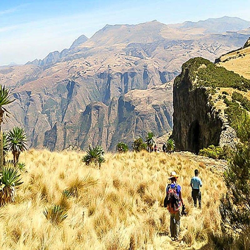 Hikers exploring the scenic landscapes of eastern Senegal, traversing rolling hills and rugged terrain—an active adventure experience thoughtfully curated by Inspiration Africa.