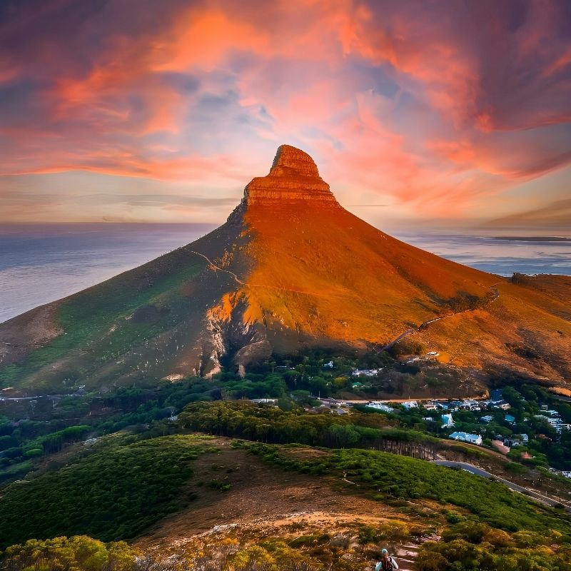 Hikers make their way along the scenic trails of Lion’s Head in Cape Town, South Africa, captured in this stunning adventure travel photograph. Rising above the city with panoramic views of Table Mountain, the Atlantic Ocean, and Cape Town’s coastline, Lion’s Head offers one of the region’s most iconic hiking experiences. Trails wind through rocky terrain, fynbos vegetation, and ridgelines, providing both adventure and breathtaking vistas, especially at sunrise or sunset. Ideal for hikers, photographers, and nature enthusiasts, this hike combines physical challenge with spectacular scenery and urban-natural contrasts. Inspiration Africa specializes in bespoke, tailor-made journeys to South Africa and across Africa, creating authentic, unforgettable hiking and adventure experiences in extraordinary destinations.