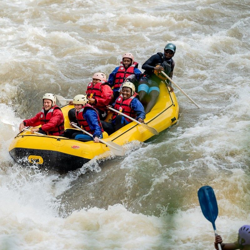 Adventurers white-water rafting on the Ash River in the Free State, South Africa—an exhilarating outdoor experience featured in Inspiration Africa curated travel journeys.