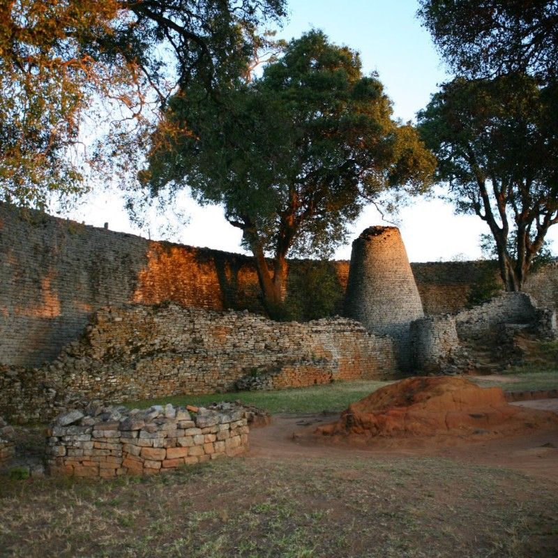 The ancient ruins of Great Zimbabwe are captured in this striking travel photograph, revealing one of Africa’s most remarkable archaeological sites. A UNESCO World Heritage Centre site, Great Zimbabwe was once the thriving capital of a powerful medieval kingdom that flourished between the 11th and 15th centuries. Its massive dry-stone walls, intricately constructed without mortar, and the iconic conical tower stand as enduring symbols of the architectural skill and cultural sophistication of the civilization that built them.
Set amid the granite hills of southeastern Zimbabwe, the ruins continue to inspire fascination and mystery, offering visitors a glimpse into one of Africa’s most important historical centers of trade, power, and culture. Ideal for history enthusiasts, archaeology lovers, and curious travelers, Great Zimbabwe provides a powerful connection to the continent’s rich and complex past.
Inspiration Africa specializes in bespoke, tailor-made journeys to Zimbabwe and across the continent, crafting authentic travel experiences that explore Africa’s iconic heritage sites and extraordinary human history.