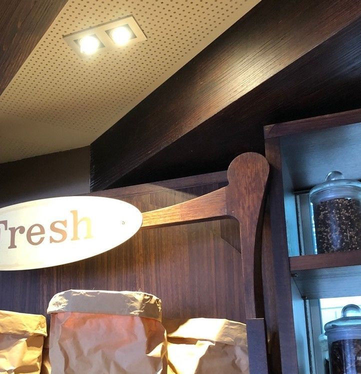 A Wooden Shelf With Bags Of Cacao On It — Joyner Electrical Pty Ltd In Carrara, QLD