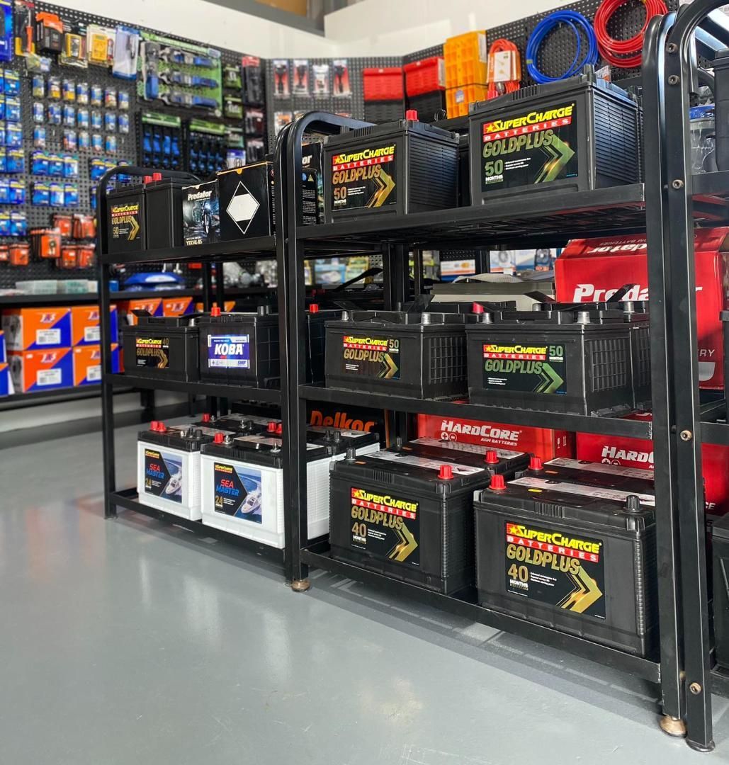 A Bunch of Batteries Are Lined Up on Shelves in a Store — Rainbow Beach 4x4 Accessories in Rainbow Beach, QLD
