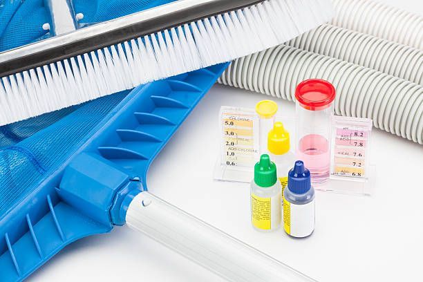 A Brush, Hose, and Bottles of Chemicals are Sitting on a Table — Dunckers in Nambour, QLD