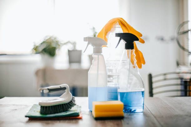 A Table Topped With Cleaning Supplies and a Brush — Dunckers in Nambour, QLD