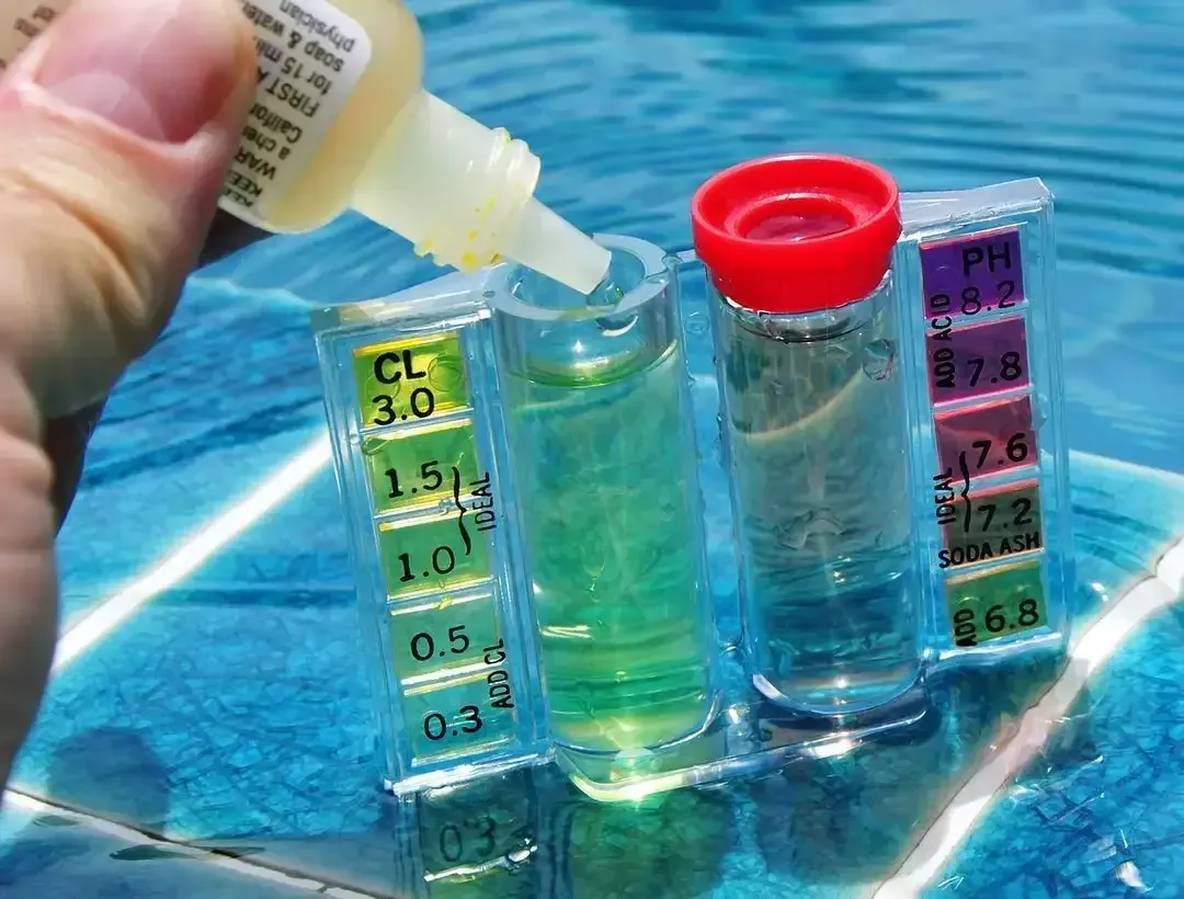 A Person is Pouring a Bottle of Liquid Into a Test Tube — Dunckers in Nambour, QLD