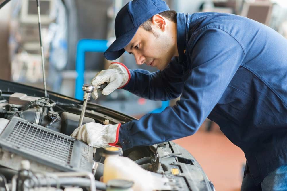 Auto Mechanic Working on a Car in His Garage - Mechanic in Port Macquarie, NSW
