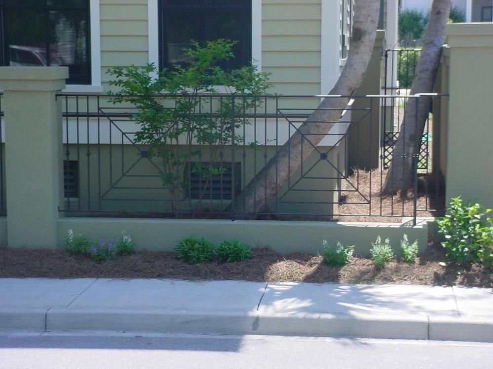 A house with a wrought iron fence around it