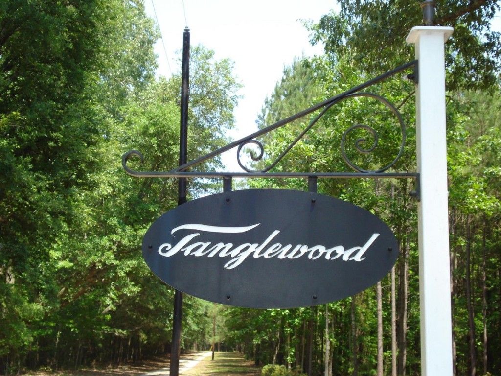 A black sign that says tanglewood on it
