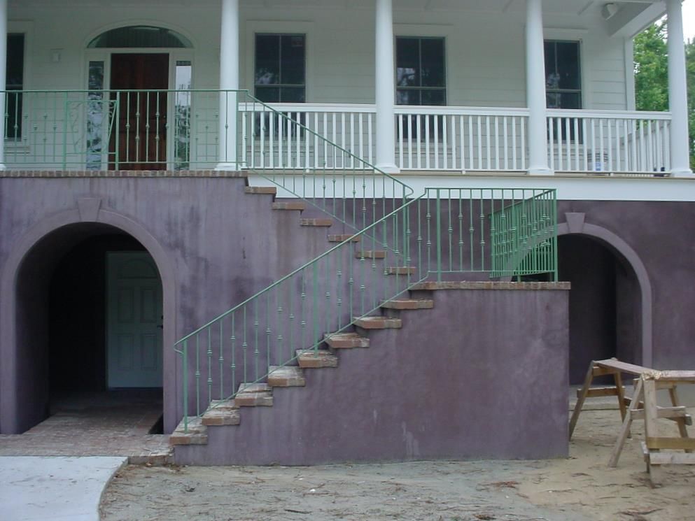 A house with stairs leading up to the porch
