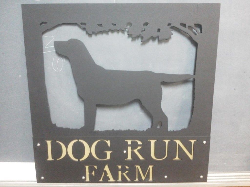 A sign that says dog run farm with a silhouette of a dog