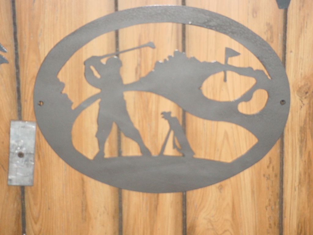 A silhouette of a man playing golf with a dog