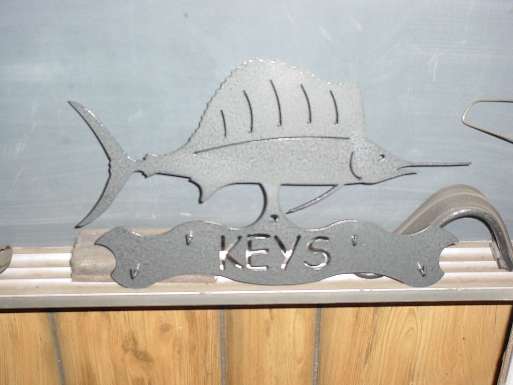 A sign that says keys with a fish on it