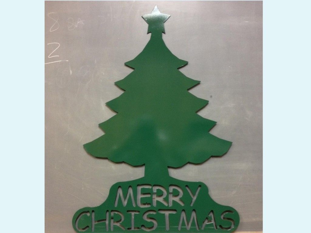 A green christmas tree with merry christmas written on it