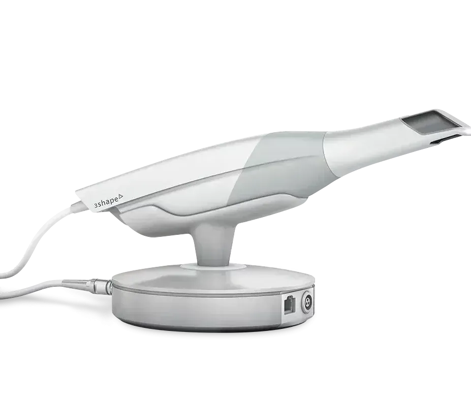 A dental scanner is sitting on a stand on a white background.