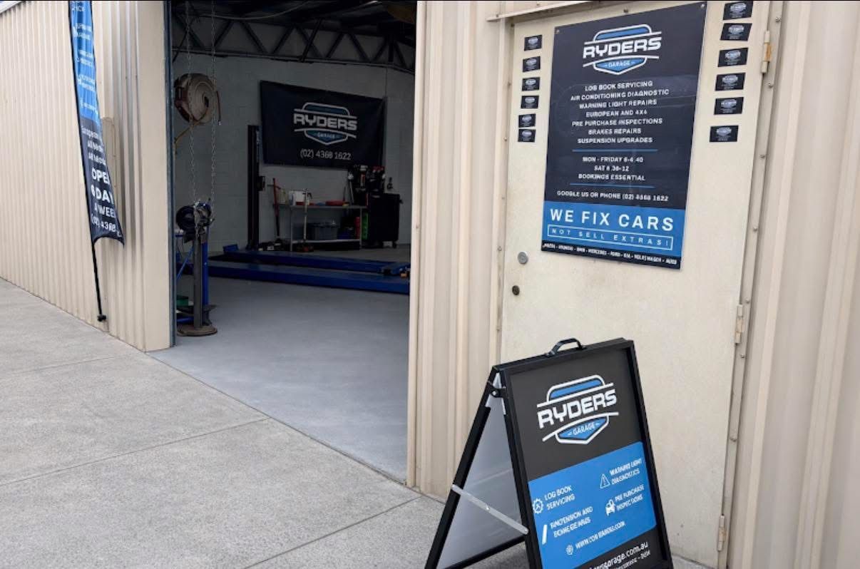 Black Business Card With Ryders Logo in White and Teal — Ryder's Garage In Kincumber, NSW