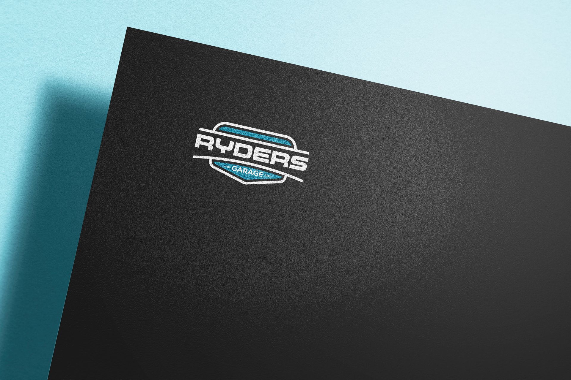 Black Business Card With Ryders Logo in White and Teal — Ryder's Garage In Kincumber, NSW