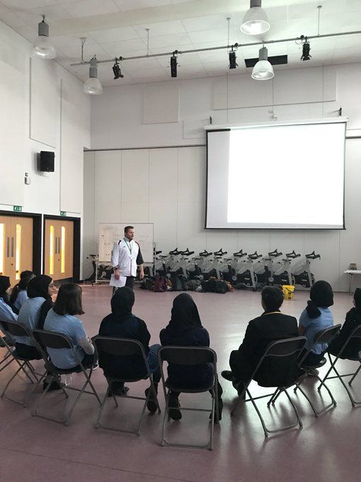 A man is giving a presentation to a group of people
