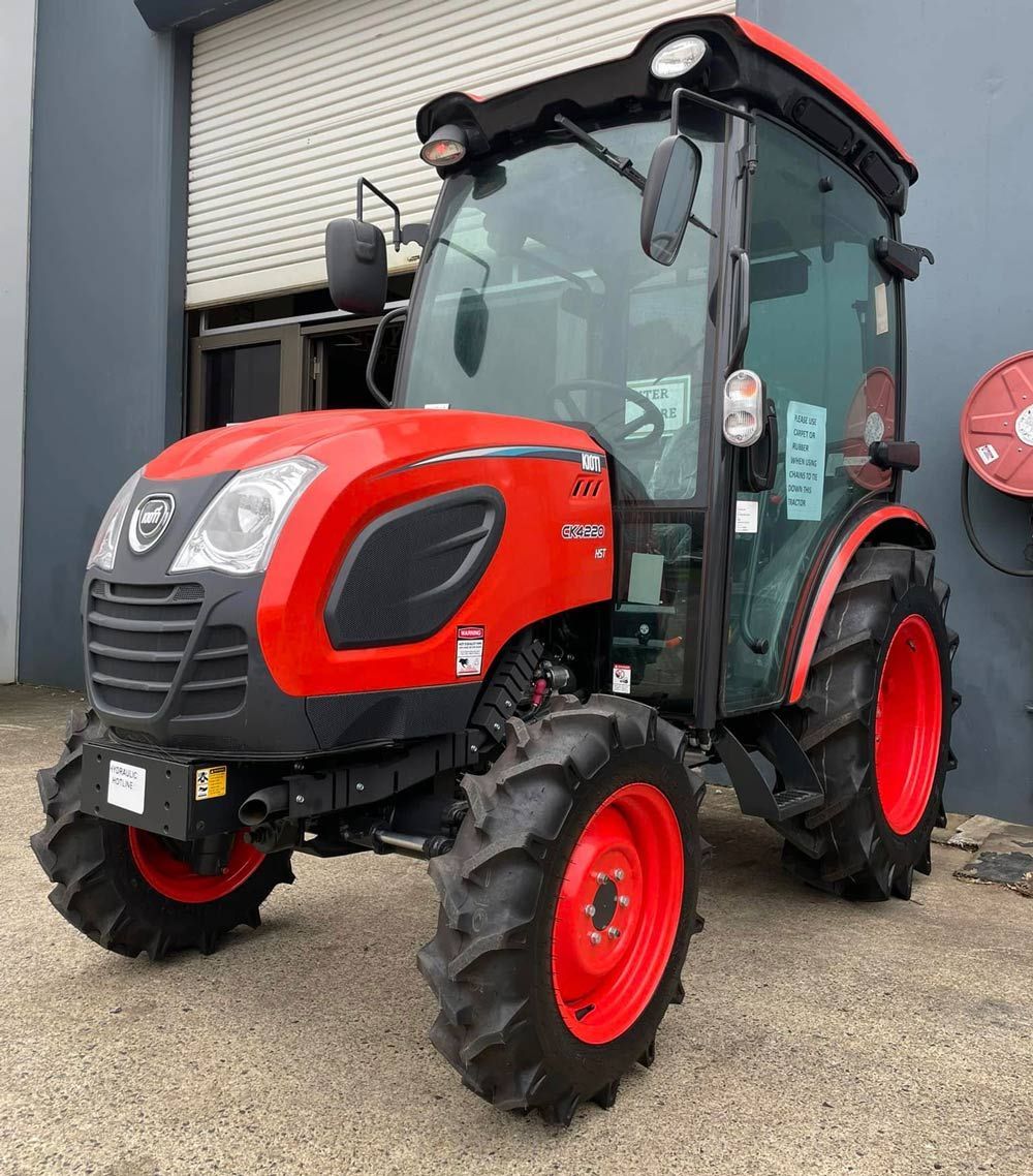 Compact Tractor Outside a Warehouse