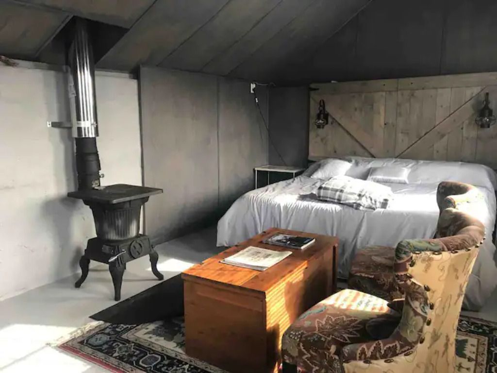 cabin bed stove and sitting area