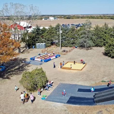 An aerial view of a playground with people playing in it.