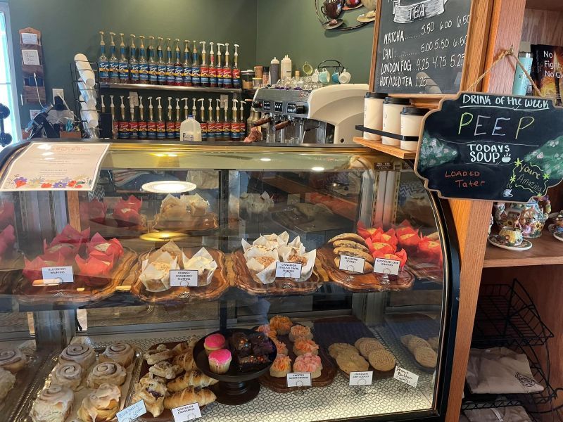 Steamy Joe Cafe Muffins A bakery with a sign that says peep on it