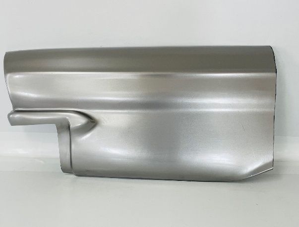 A shiny, silver-colored automotive body panel with distinct angular features and a protruding section.