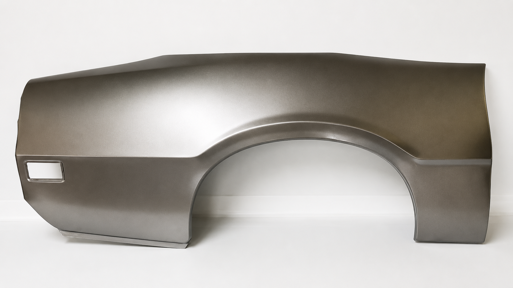 Gray car body panel, likely a rear quarter panel with wheel arch cutout.