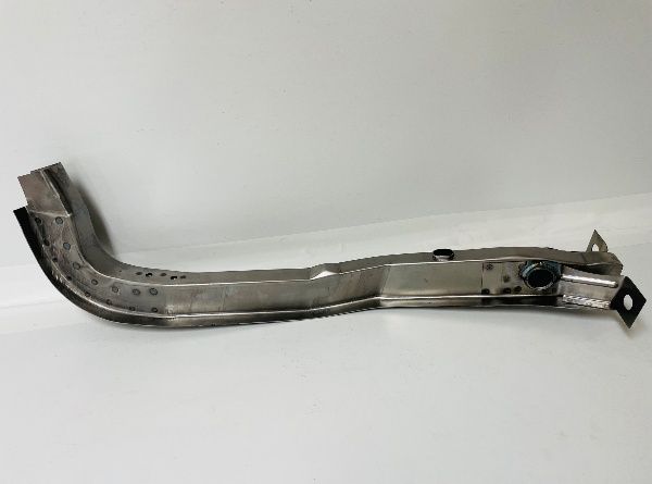 A metal car frame rail. It is silver with a curved shape and various mounting holes.