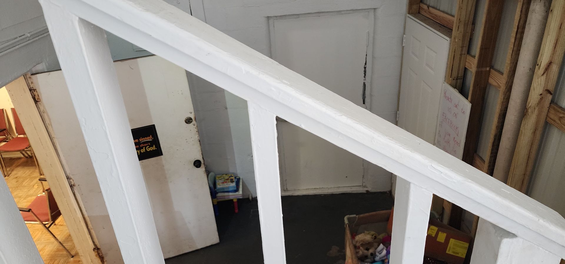 A view of a staircase from the second floor of a house.