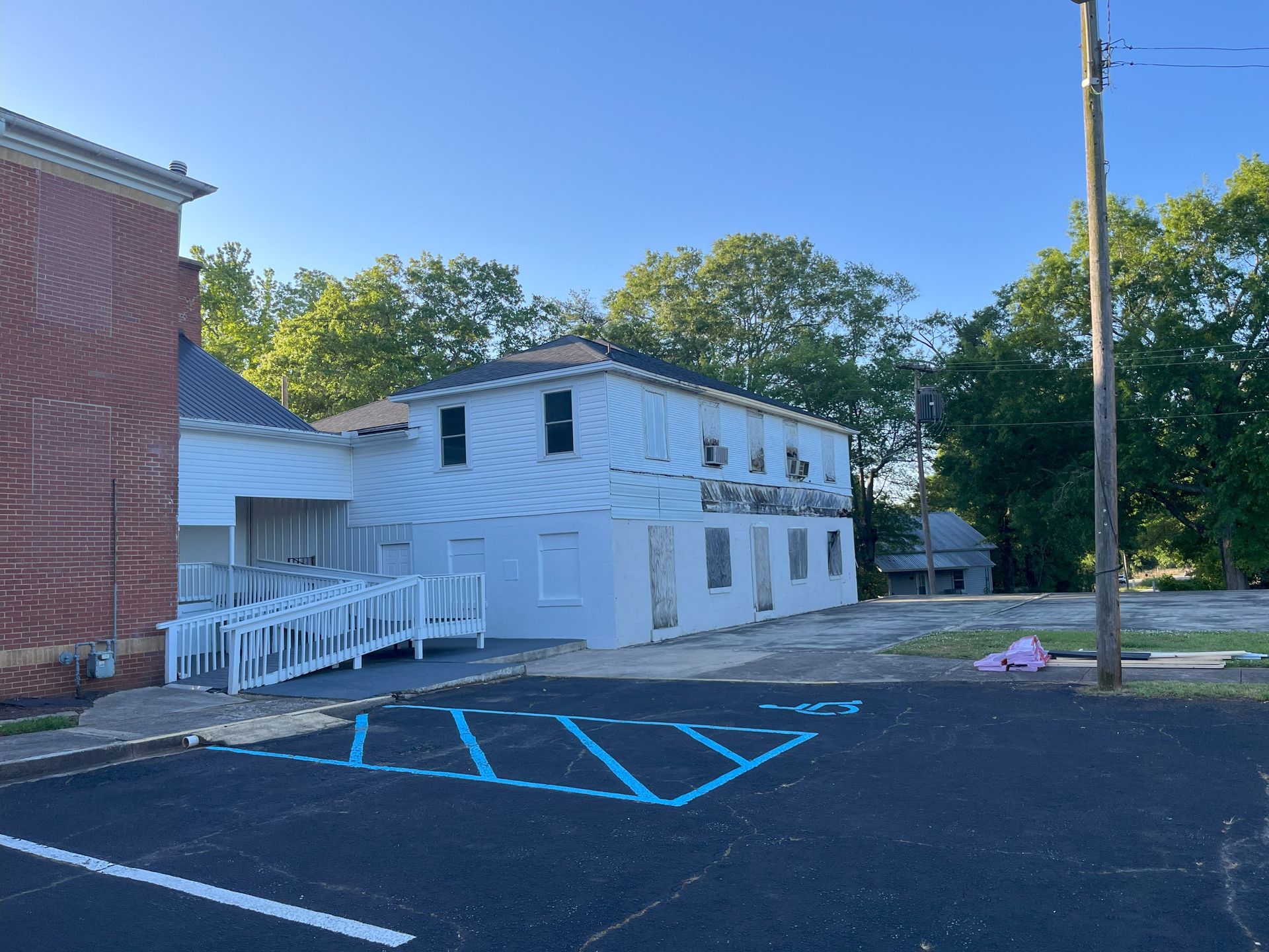 There is a handicapped parking spot in front of a building.
