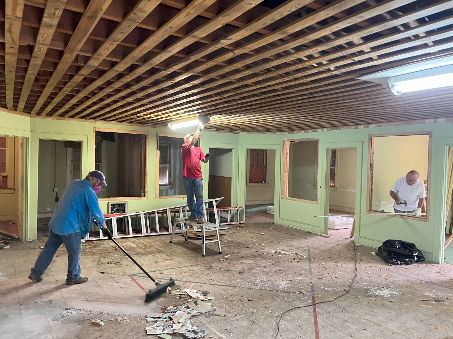 A group of men are working on a building.