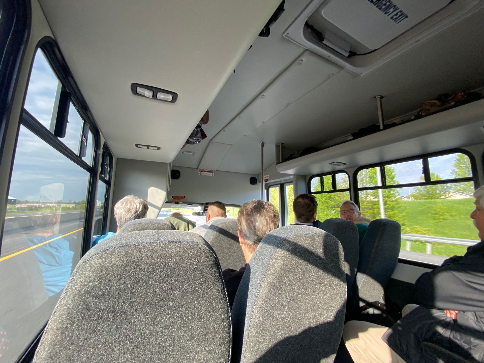 A group of people are sitting on a bus.