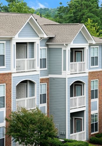 Image of multifamily apartment building - click to view multi-family & strata services page