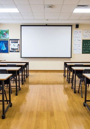 Image is of inside a classroom setting - click to visit the educational facility services page