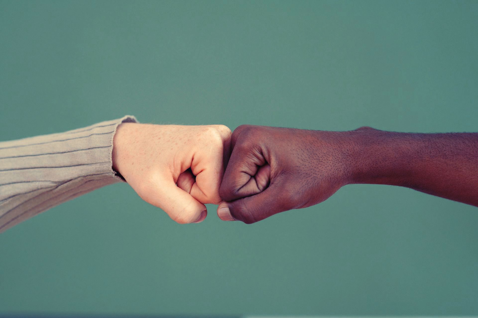 people fist bumping