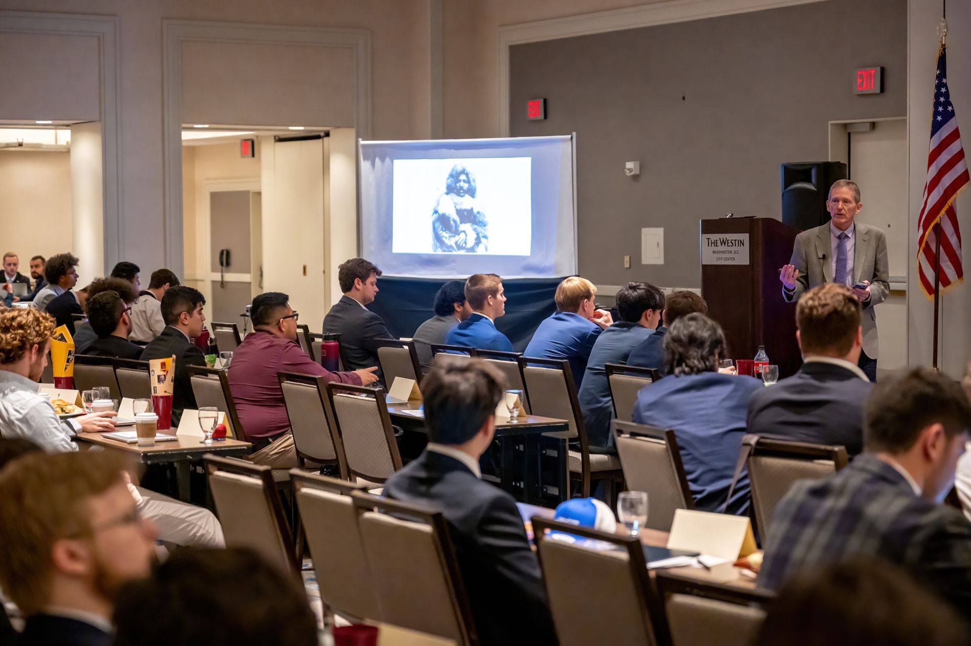 Deke Conference Speaker showing a powerpoint on a projector at the DKE Conference