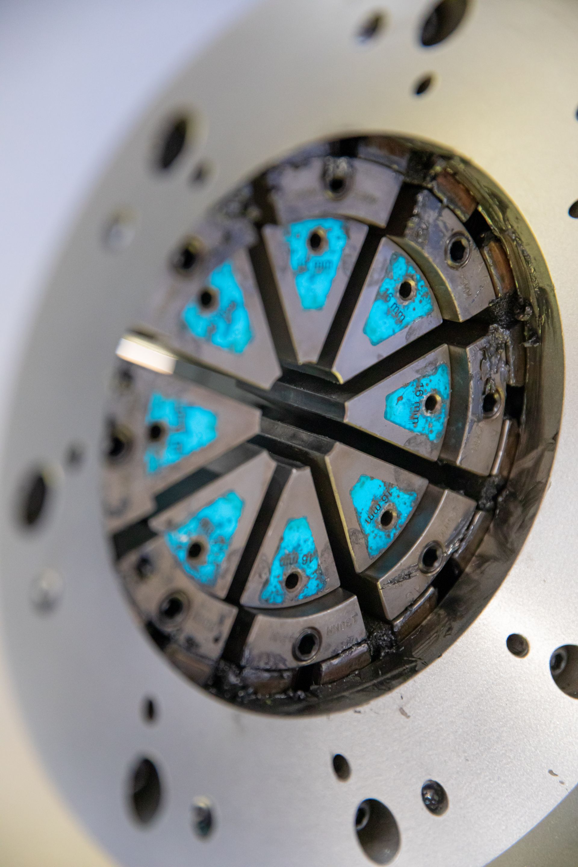 A close up of a machine with holes in it for hydraulic and industrial hose repair.