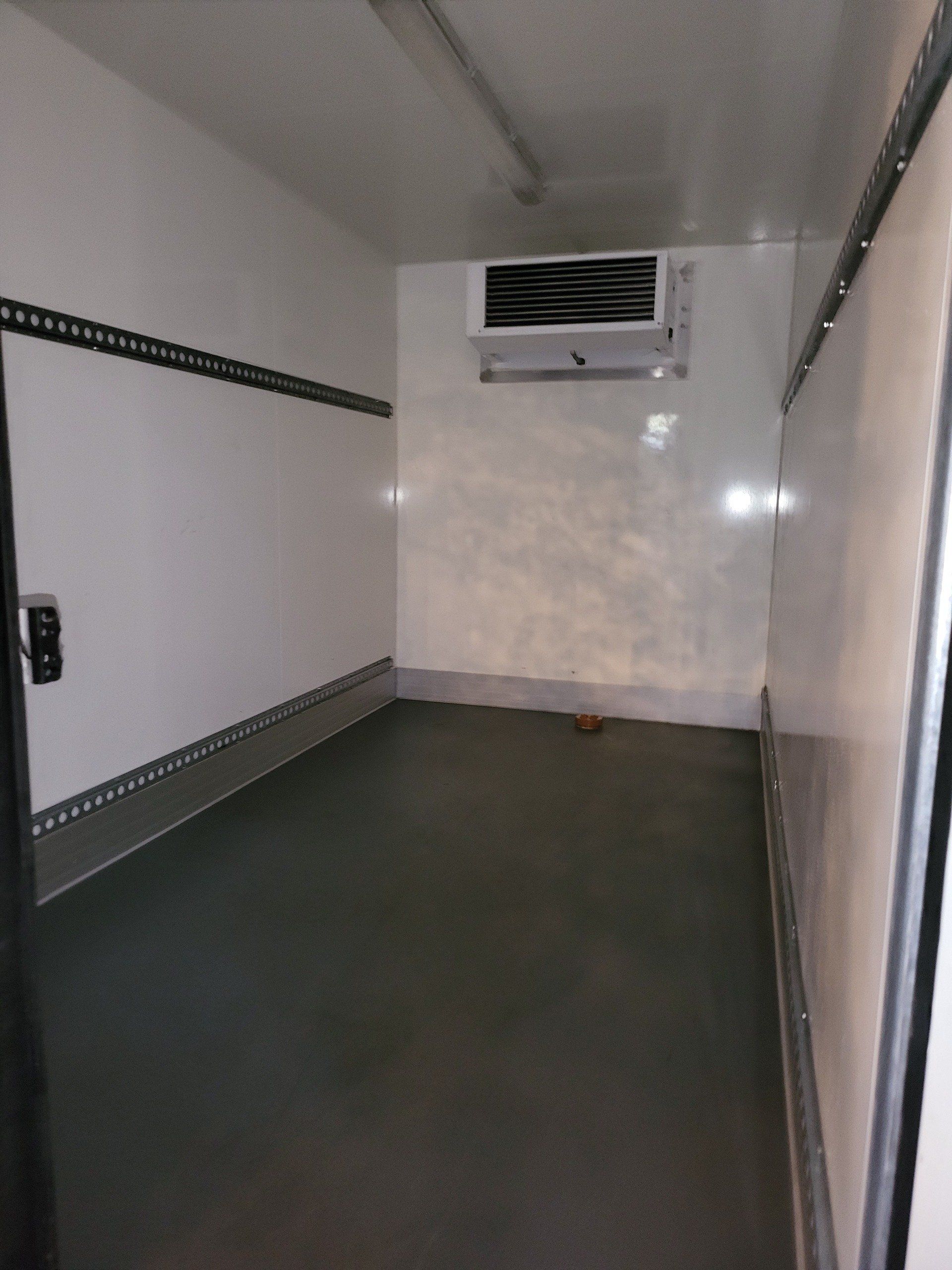 inside an empty fridge trailer