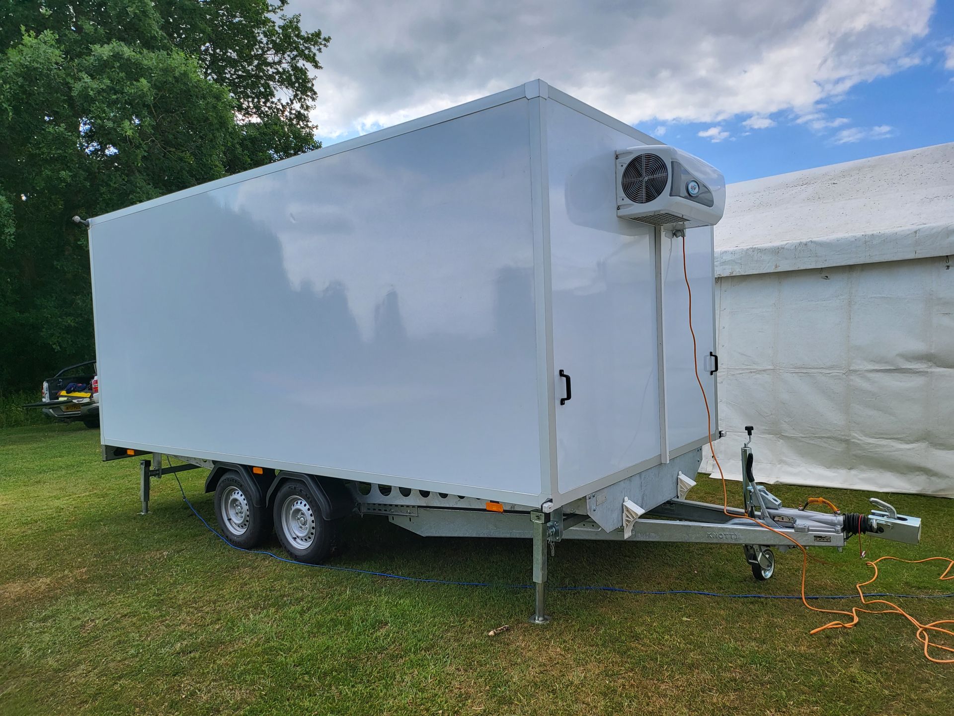 Split compertment refrigerated trailer set-up nect to a Marque for a S=school event