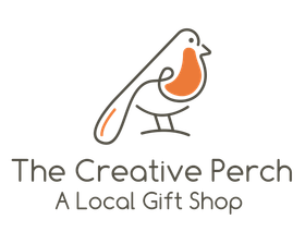 Logo for The Creative Perch, a local gift shop, with a stylized bird in orange and gray