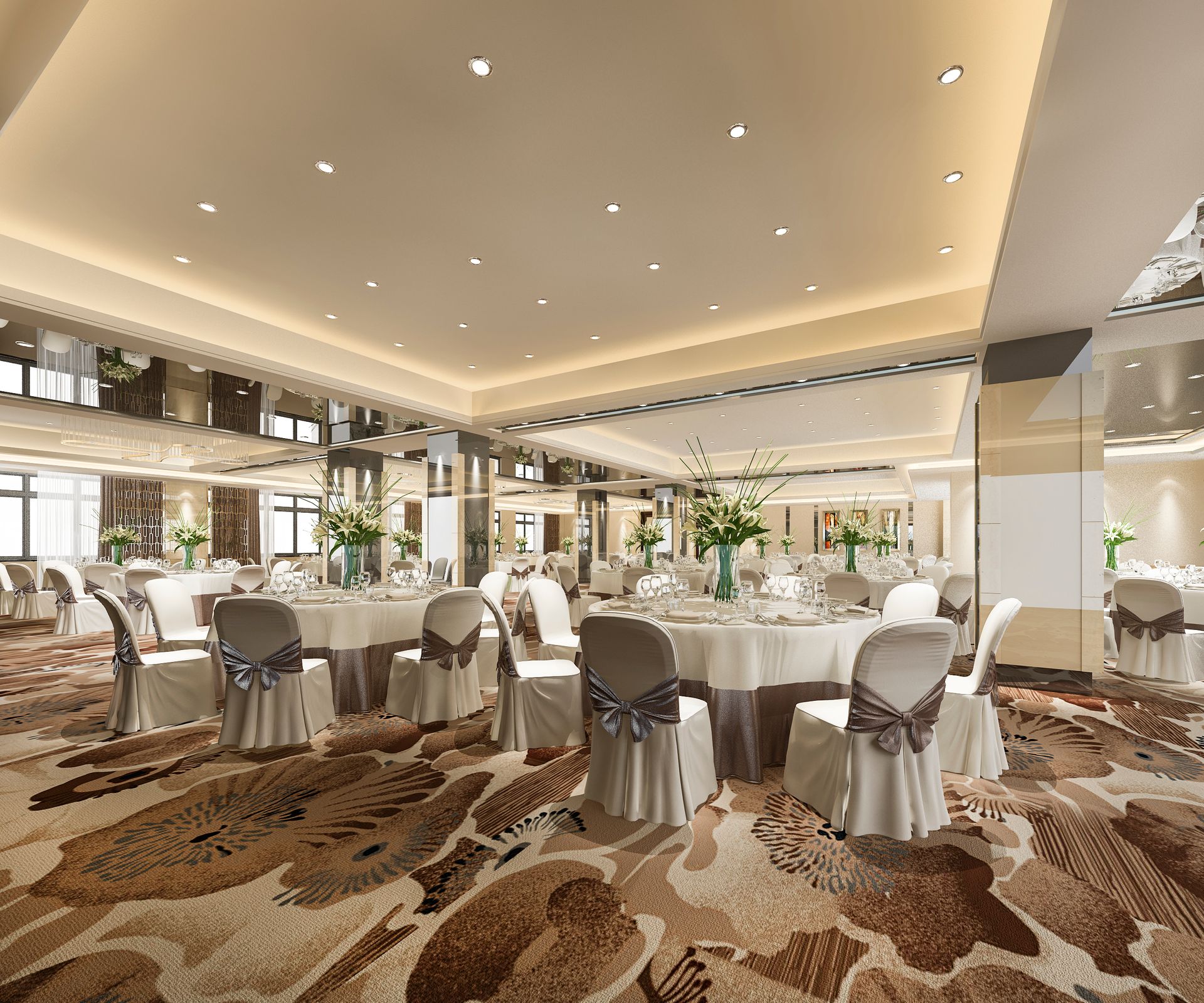 Elegant banquet hall with round tables, white chair covers, and patterned carpet in warm neutral tones