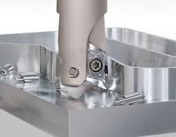 A person is using a machine to measure a piece of metal
